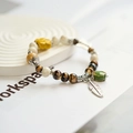 Bohemian ceramic bracelet with tiger eye beads, silver butterfly and feather charms - 753-03 Qingqing
