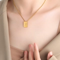 Minimalist square gold bar pendant necklace featuring engraved letter F on model - Letter F Style (P1506-F)