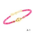Detail of rose red carnelian beaded bracelet with gold plated beads and lobster clasp - Rose Red Chalcedony Round Bead