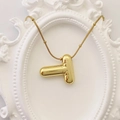 Golden letter T balloon pendant necklace with beaded chain on a white frame background - Gold Letter T