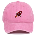 Close-up of pink washed cotton baseball cap with rocket embroidery and vintage texture - Adjustable / Pink