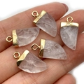 Hand holding white crystal tooth charms with gold plated edges for jewelry making - 10x20mm / White Crystal