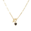 Close-up of gold-plated OT clasp with heart pendant and sparkling pavé crystal details - Gold Black Zirconia