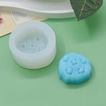 Gedetailleerd overzicht van de siliconen mal met sterpatroon en blauwe kaars - Hele Koekjesstijl