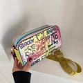Rainbow gradient crossbody bag with colorful graffiti patterns and wide yellow strap - Colorful