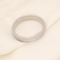 Macro shot of silver elastic steel bracelet with flexible textured snake bone structure - Silver - 15mm