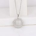 Polished silver seashell locket pendant on O-chain necklace with heart-shaped detail - Shell Shape/Steel