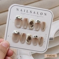 Detail shot of handmade French cat-eye press-on nails with bamboo leaf patterns - French Cat Eye Oriental Style (FM046) / XS