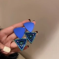 Detailed shot of geometric blue crystal earrings with sparkling rhinestone inlay - Blue Geometric Rhinestone Triangle Earrings