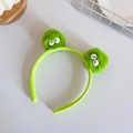 Cute green plush frog headband with large googly eyes for face washing and styling - Tosca Headband