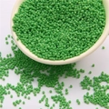 2mm green glass seed beads for DIY jewelry making in a white ceramic bowl - Grass Green