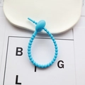 Sky blue silicone cable tie with adjustable notched strap and circular lock fastener - Blue