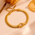 Detailed close-up of gold stainless steel snake chain bracelet with cat-eye stone inlay - Gold with White Cat Eye Stone