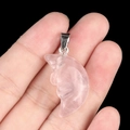Carved crescent moon face pendant in translucent pink crystal with metal bail - Rose Quartz