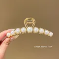 Large 11cm pearl hair claw clip with golden finish for elegant hair updos. - Nine Pearl Cat Eye Claw Clip