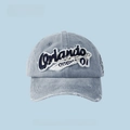 Washed denim baseball cap in blue featuring Orlando embroidery and distressed edges - Orlando Embroidery - Gray Denim