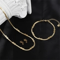 Macro detail of 18k gold plated infinity necklace and bracelet set on black silk - Infinity (S00058G-6)