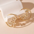 Detail of gold-plated hoop earrings with zircon flower inlay on geometric props - Gold Flower Geometric Hoop Earrings
