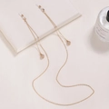 Detail of golden eyeglass chain featuring teardrop crystals and silicone anti-slip loops - Waterdrop-Gold