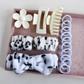Detail of 16-piece hair accessory set with plush bow headband and floral clips in tray - Black & White Pattern (16-Piece Set)