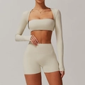 Three-piece beige yoga set featuring long-sleeve shrug, sports bra and high-waisted shorts - S / Top And Bottom / Oat Apricot