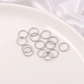 Silver stainless steel open jump rings for DIY jewelry making displayed on a white plate - 10mm Jump Ring (200 Pieces/Pack)