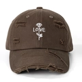 Close-up of vintage brown baseball cap with rose embroidery and distressed details - One Size / Coffee