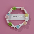 Colorful ceramic bead bracelet with bone-shaped charms and mint green accents - 1586-17 White Bone Color Beads