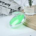 Green crystal clear scalp massager brush with silicone bristles on wooden stand - Crystal Green