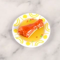 Miniature fake food model featuring braised chicken leg on white plate with sauce - Mini Chicken Leg - No Keychain