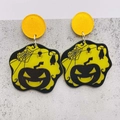 Macro shot of Halloween acrylic earrings featuring a pumpkin, cobweb and bat pattern - JE1011I (Yellow Pumpkin Spiderweb)