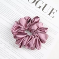 Elegant rose pink satin scrunchie with soft pleats on a fashion magazine background - Korean Pink
