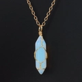 Macro detail of wire-wrapped opal hexagonal prism pendant with elegant gold chain - Opalite (with chain)
