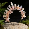 Detail of handmade crown featuring pink crystal shards and rhinestones on mossy stone - Iridescent Rose Quartz + Rhinestone Flower
