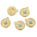 Five pieces of golden bohemian compass pendants with turquoise stones in 18K plated steel - Turquoise