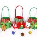Three felt Christmas gift bags with reindeer, snowman, and puppy designs on white fur - Non-woven Elf Bag (Mixed Random)