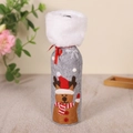 Detailed view of Christmas wine bottle cover with reindeer pattern and white faux fur trim - Elk Style