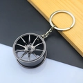Detail view of a gunmetal car wheel rim keychain with a multi-spoke alloy hub design - 37MM Wheel Rim / Black