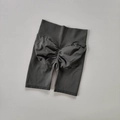 Close-up of charcoal grey high-waisted seamless scrunch butt lifting biker shorts - Gray