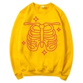 Bright yellow long sleeve hoodie featuring pink skull ribcage and four-point star prints - S / Tops / Yellow (Pink Skeleton Print)