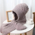 Close-up of chunky knit hooded scarf in dusty rose pink on a minimal white table - Beige Grey