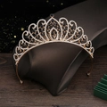 Detail shot of golden alloy crown with black gemstones and white rhinestones - Gold Black Zirconia