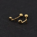 Macro view of gold eighth note stud earrings with secure screw-on ball backings - Music Note / Gold