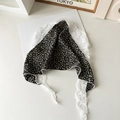 Close-up of black floral pattern headscarf featuring delicate white lace trim details - Small Floral Lace / Black