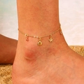 Golden bohemian anklet with starfish and shell pendants worn on beach sand - Gold Fine Chain Shell Starfish Pendant Anklet (12kc金5170)