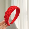 Close-up of red satin hand-woven thick headband showing 3D texture and glossy finish - Red