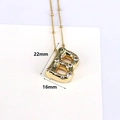 Macro shot of 18k gold bubble letter B pendant with zircon stones and dimensions - Letter B