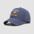 Detail of embroidered skateboarding dinosaur and laser-cut breathability holes on kids cap - 54cm (3-8 Years Old) / Blue