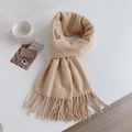 Detailed view of beige cashmere-feel knitted scarf featuring elegant tassel edges - Regular Fit / Beige