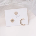 Macro detail of asymmetric gold star and moon earrings with S925 silver needles - Gold Asymmetric Star Moon